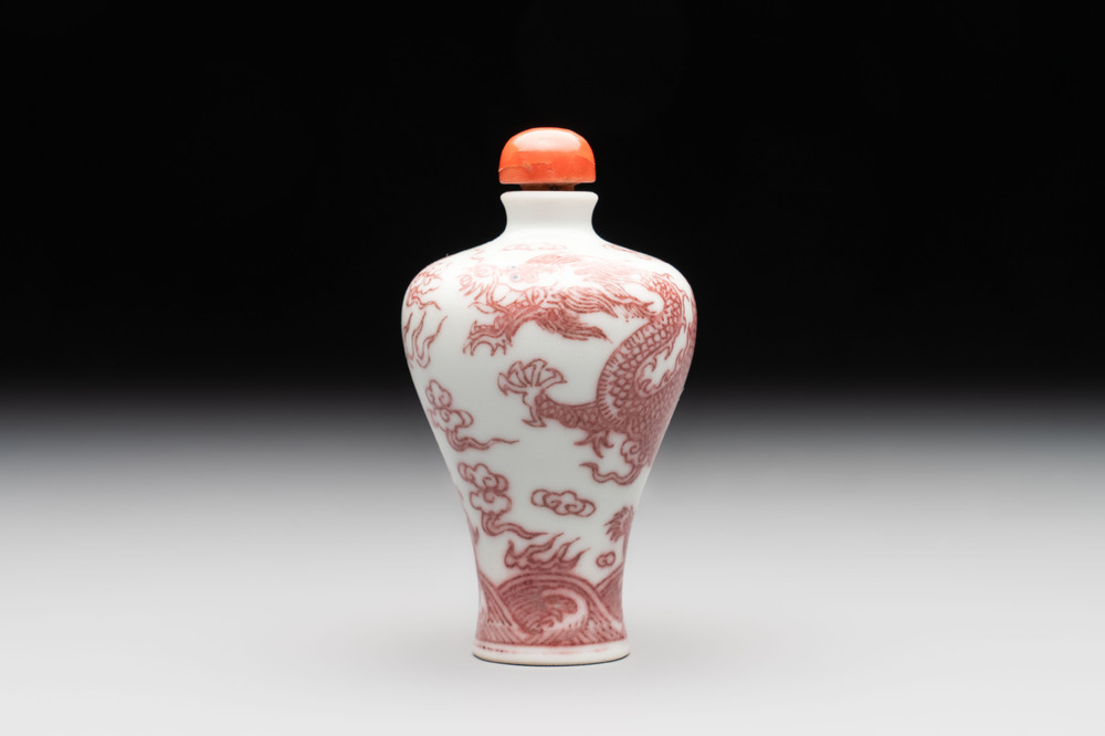 A Chinese blue, white and copper-red 'dragon' snuff bottle, 19th C.