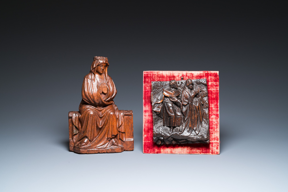 A carved oak figure of a seated Mary and a panel with Saint John the Baptist and Mary, Flanders and/or Northern France, 15/16th C.