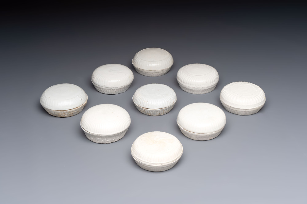 Nine Chinese white-glazed boxes and covers with incised floral design from the Jepara shipwreck, Dehua or Anxi kiln, Song