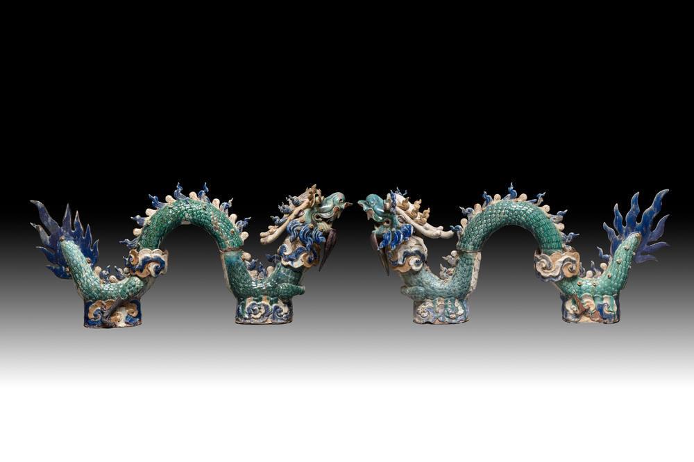 A pair of large Chinese polychrome-glazed Shiwan stoneware dragons, 19th C.