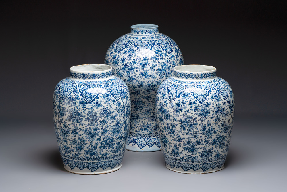 An exceptional large blue and white Dutch Delft garniture of three vases, late 17th/early 18th C.