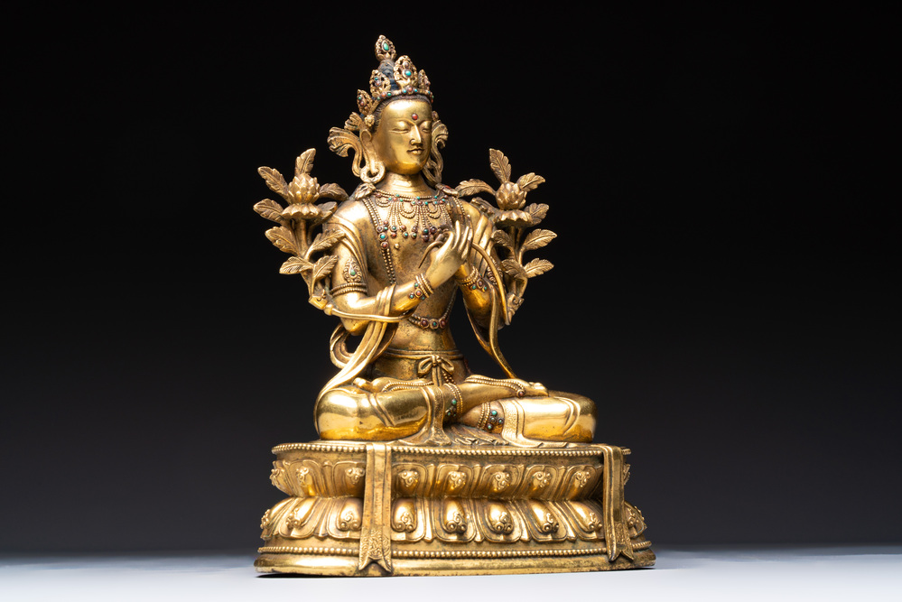 A fine Sino-Tibetan turquoise- and coral-inlaid gilt-bronze Buddha Maitreya, Kangxi