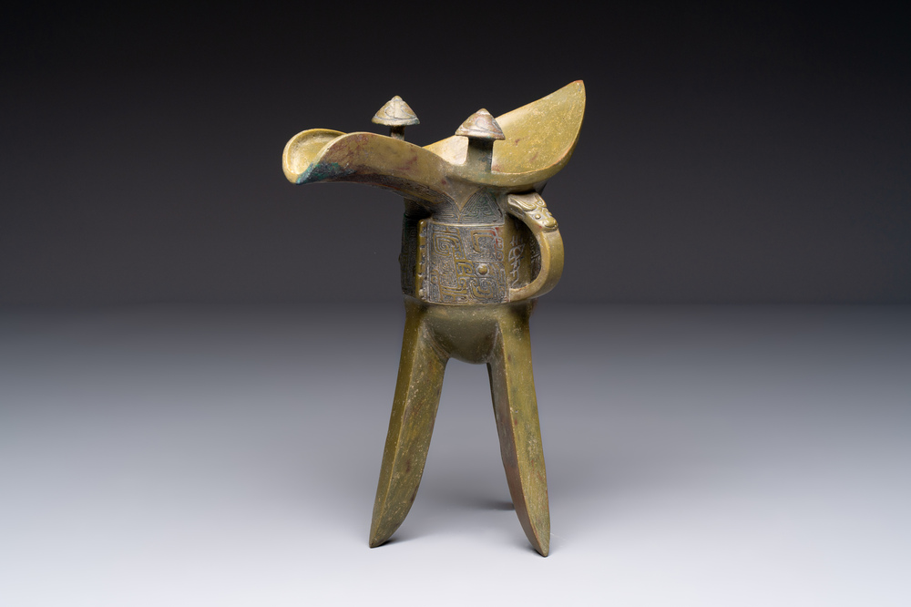 A Chinese archaic bronze wine vessel, 'jue 爵', late Shang