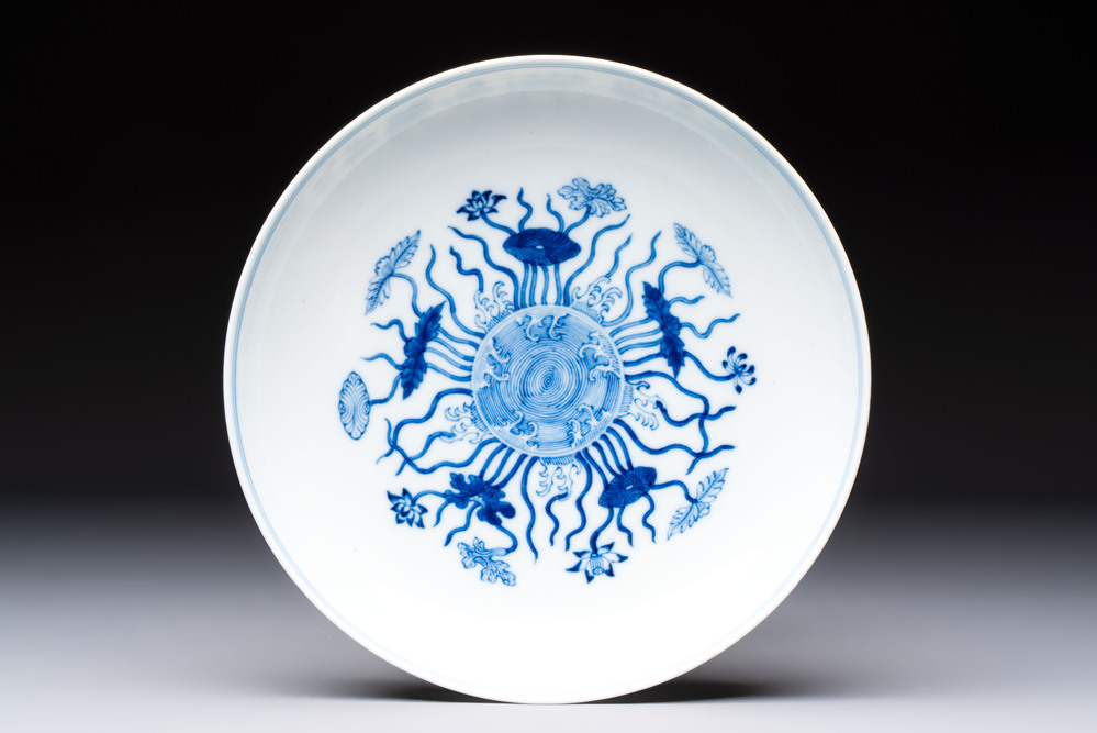 A Chinese blue and white 'lotus pond' plate, Qianlong mark, 19/20th C.