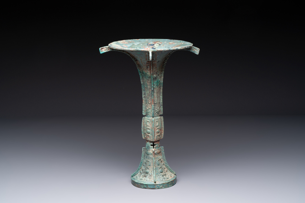 A Chinese archaic bronze wine vessel with 'taotie' design, 'gu 觚', Shang