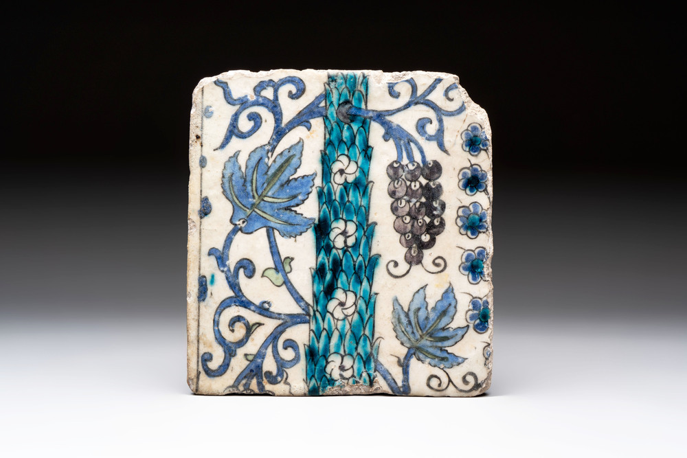 A polychrome Damascus tile with grapevines and flowers, 17th C.