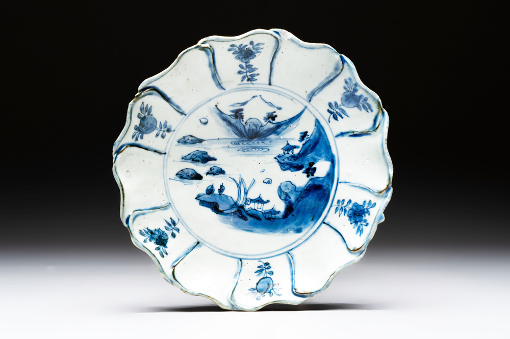 A Chinese blue and white ko-sometsuke flower-shaped tripod 'landscape' plate for the Japanese market, late Ming