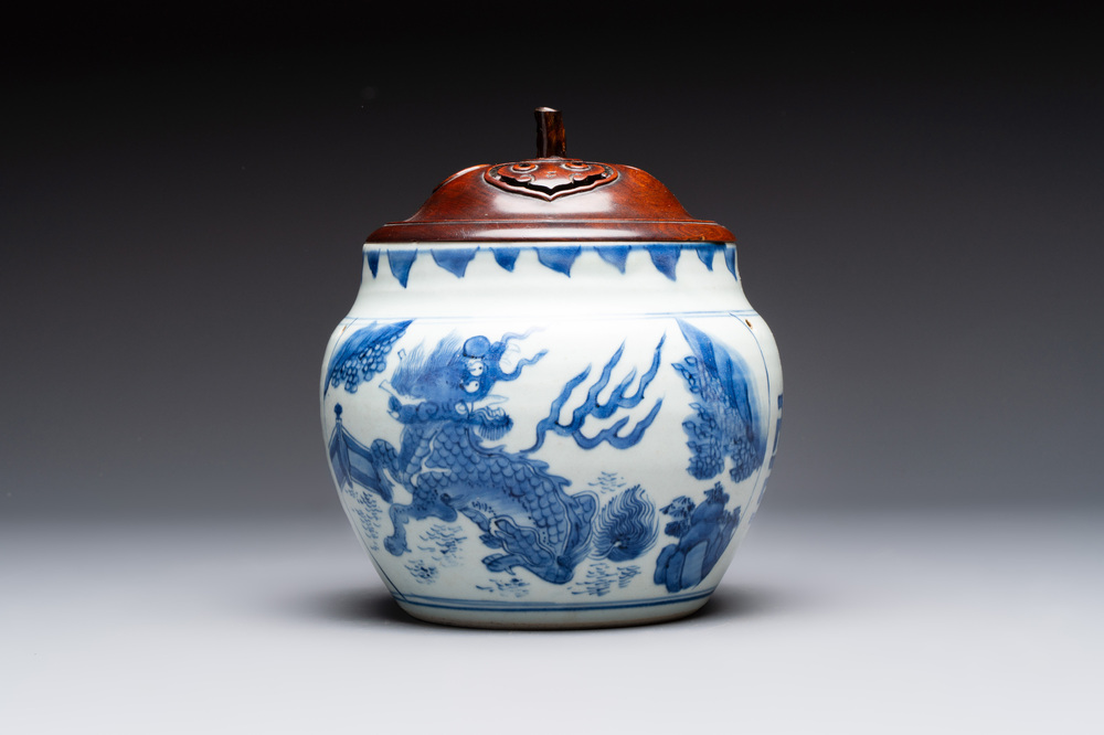 A Chinese blue and white 'qilin' jar and wooden cover, Transitional period
