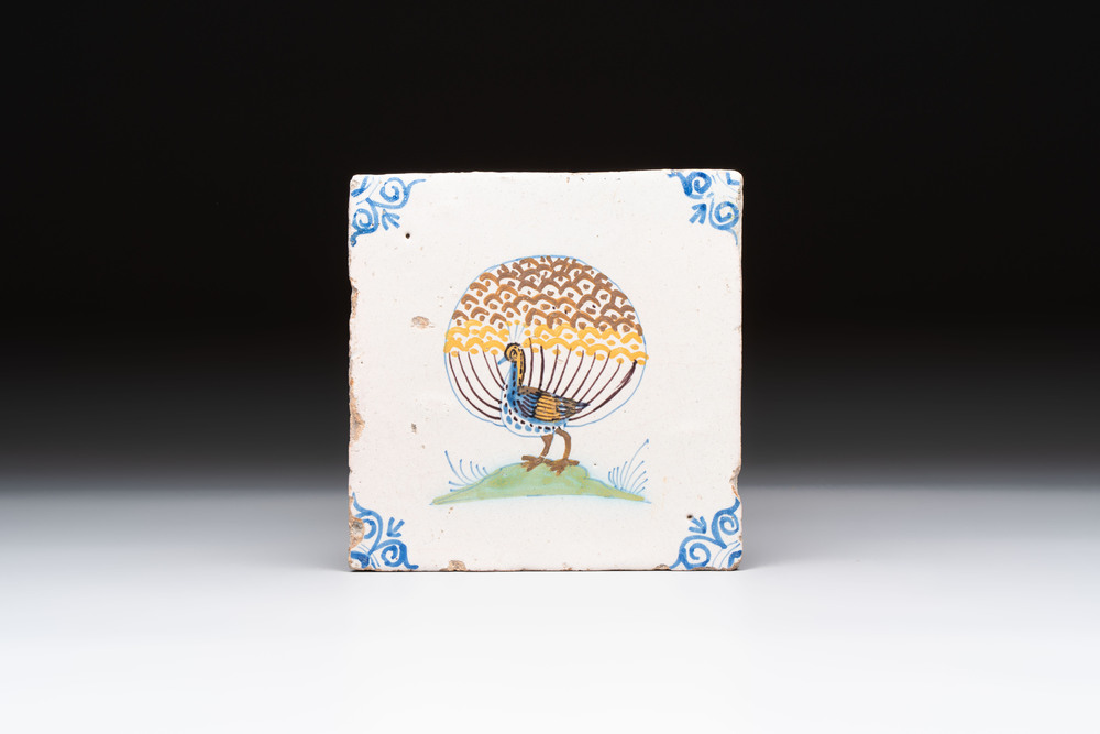 A polychrome Dutch Delft 'peacock' tile, 17th C.