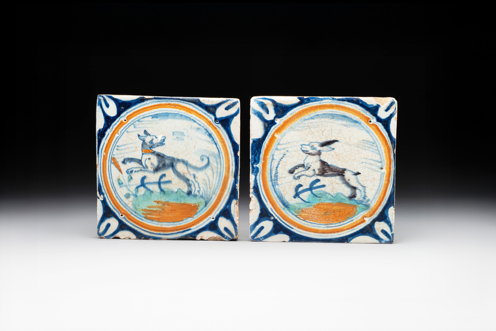 Two polychrome Dutch Delft maiolica 'dog' and 'hare' medallion tiles, late 16th C.