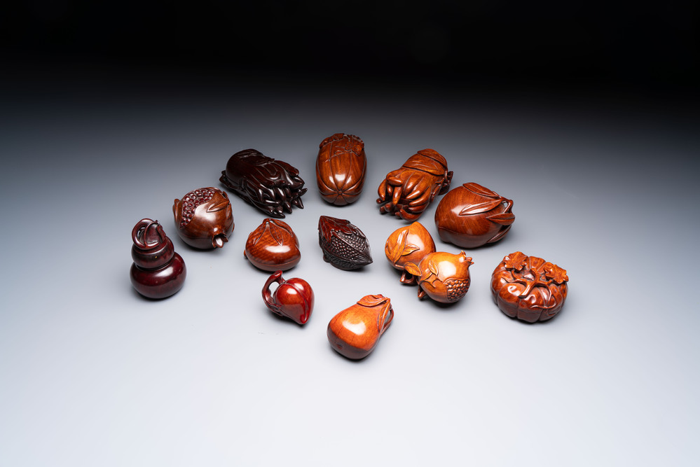 12 various Chinese carved huali and hongmu fruit-form covered boxes, 20th C.