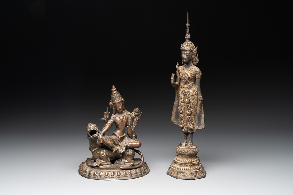 A bronze Simhanada Lokeshvara seated on a Buddhist lion and a Buddha, Southeast Asia, 19th C.
