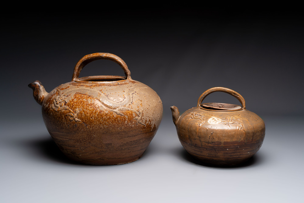 Two brown-glazed 'dragon' ewers with relief design, Qing