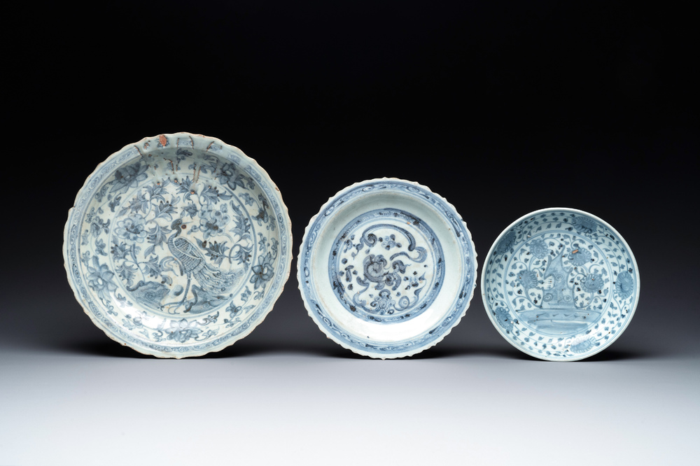 A Chinese blue and white 'phoenix' dish and two 'Buddhist lion' and 'peony' plates, Hongzhi/Zhengde