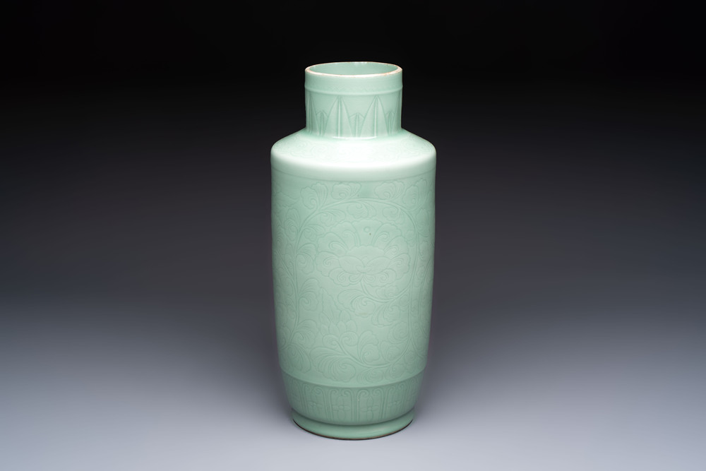 A Chinese celadon-glazed rouleau vase with incised floral design, 18th C.