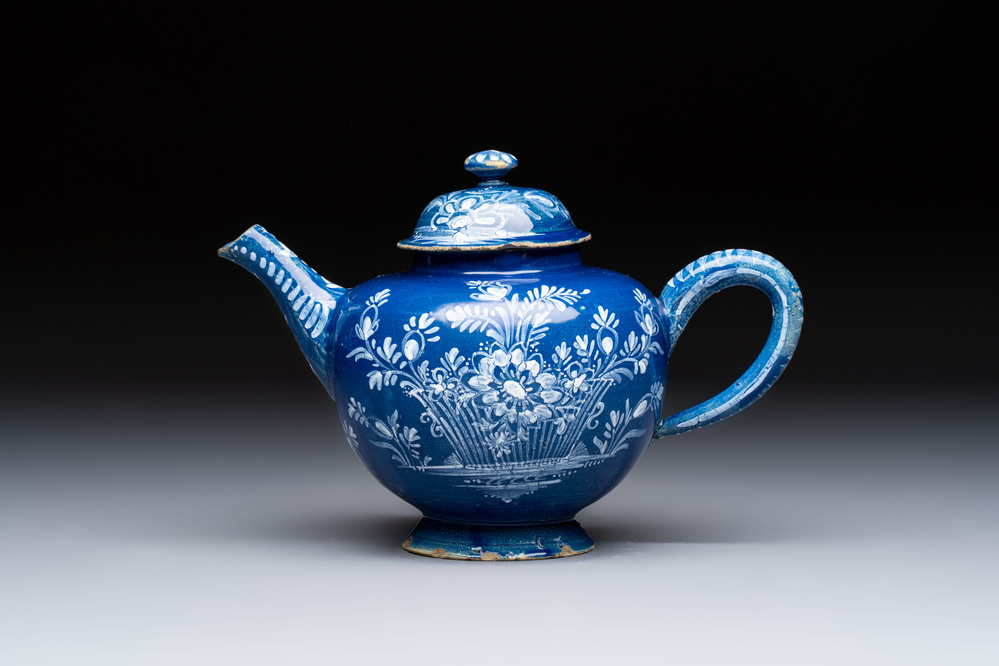 A Nevers white-decorated blue-ground faience teapot and cover, France, 18th C.
