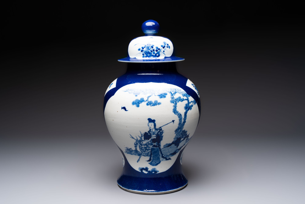A Chinese blue and white powder-blue-ground 'He Xiangu 何仙姑' vase and cover, 19th C.