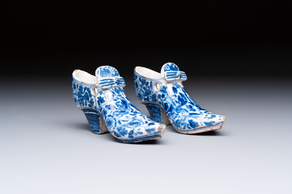 A pair of blue and white Delftware shoes with floral design, France, 18th C.