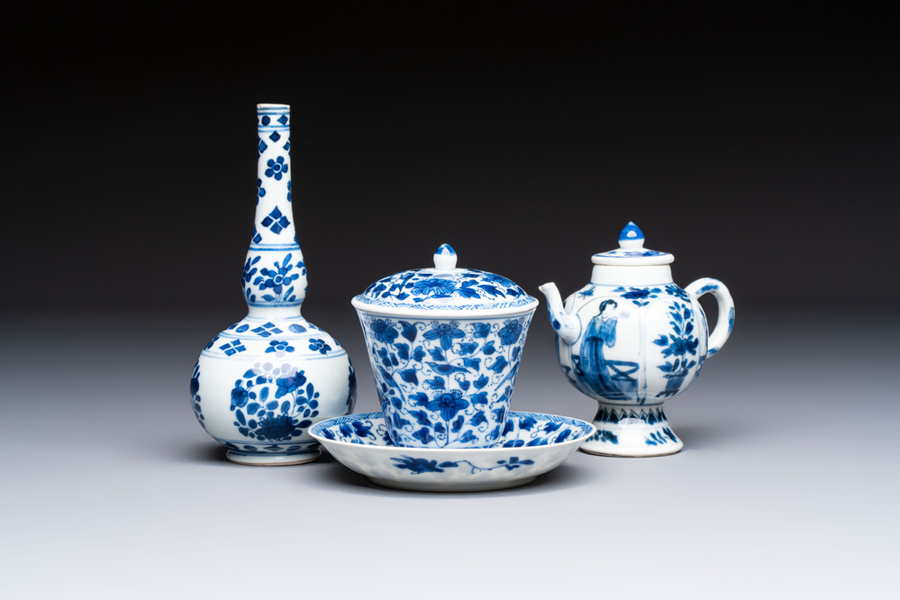 A Chinese blue and white covered ewer, a rose water sprinkler, a covered cup and saucer, jade 玉 and twin-fish mark, Kangxi