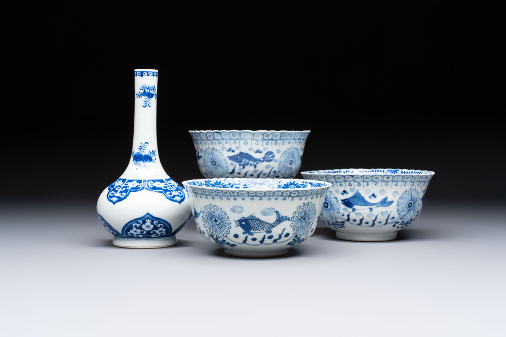 Three Chinese blue and white 'Fish' bowls and a bottle vase, Kangxi marks, 19th C.