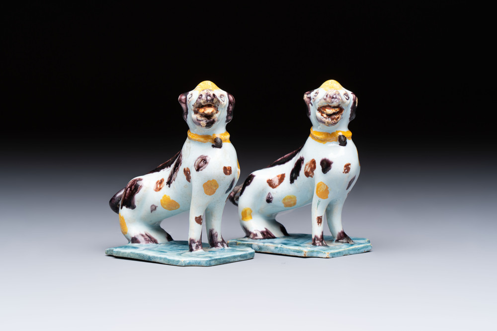 A pair of polychrome Dutch Delft models of dogs, 18th C.