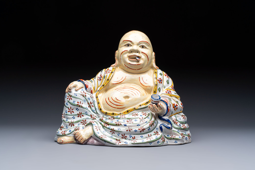 A polychrome Dutch Delft 'Budai' figure, 19th C.