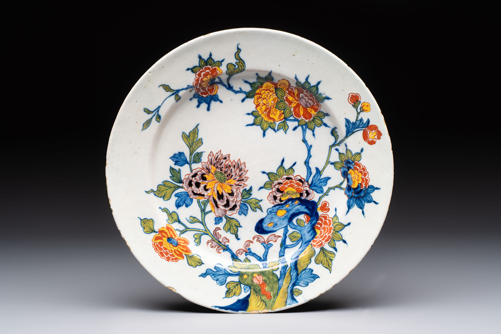 A polychrome Dutch Delft plate with floral design, late 17th C.