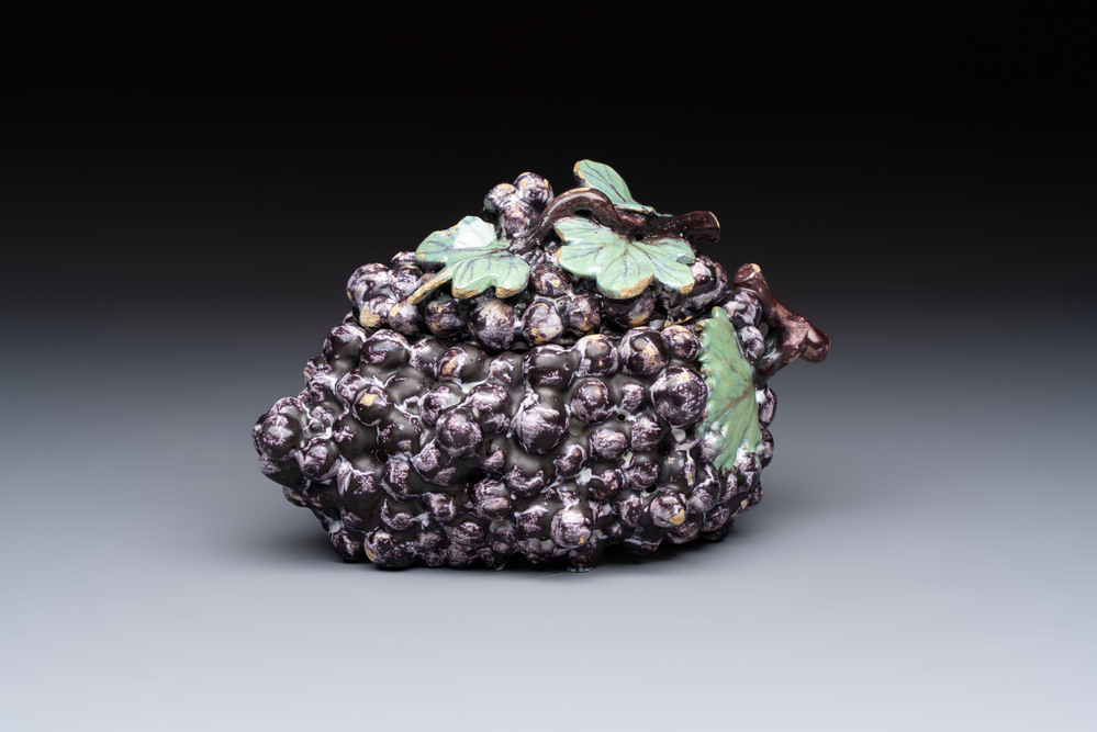 A polychrome Dutch Delft 'Bunch of Grapes' tureen and cover, 18th C.