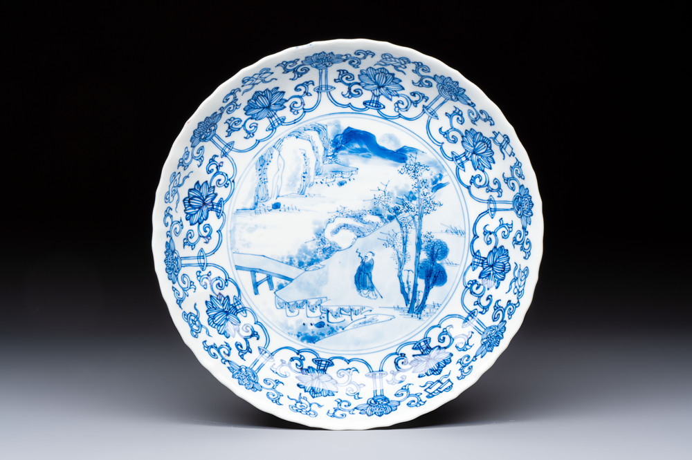 A very fine Chinese blue and white plate with a scholar in a landscape, Kangxi mark and of the period