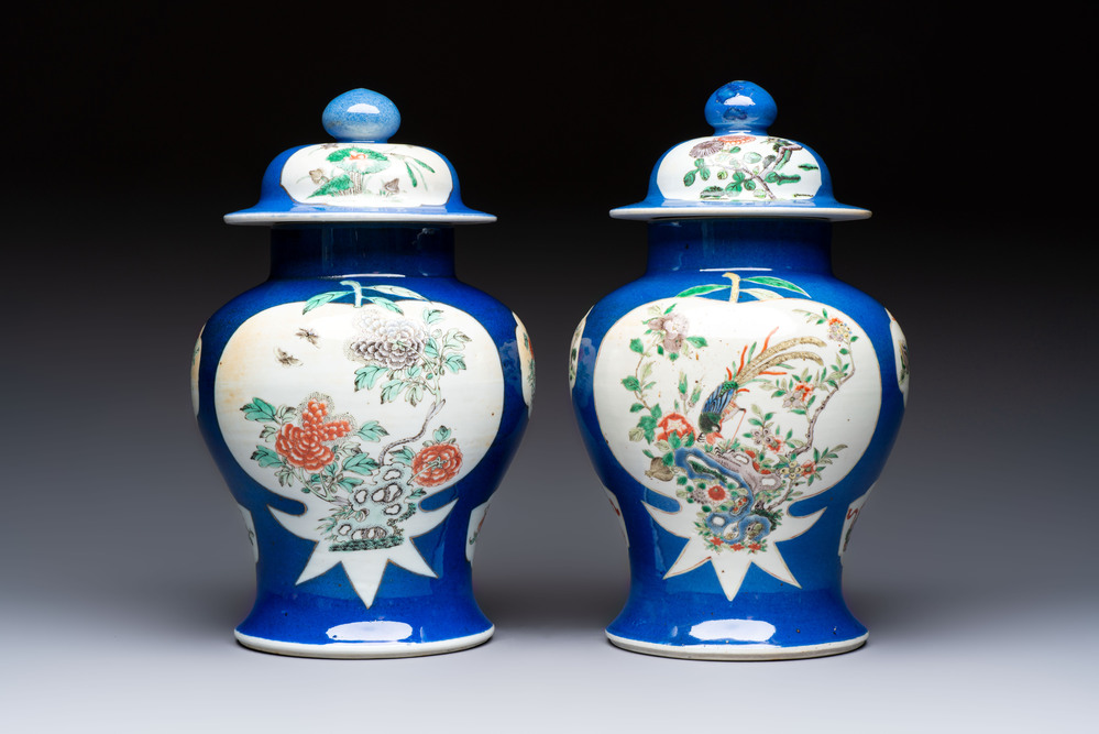 Two Chinese famille verte blue-ground vases and covers, 19th C.