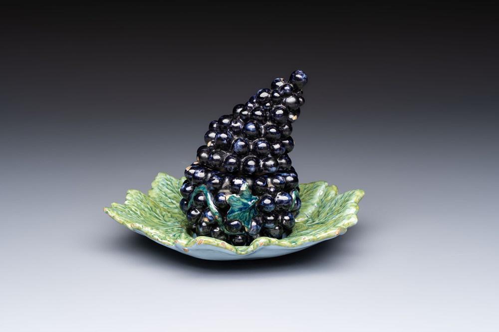 A polychrome Dutch Delft 'Bunch of Grapes' tureen and cover, 18th C.