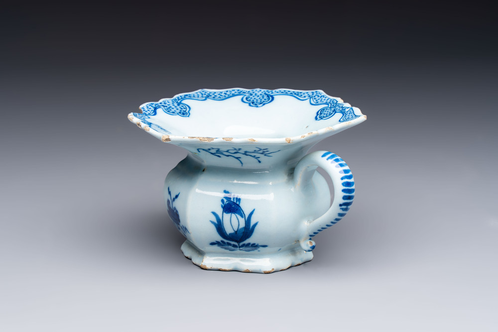 A blue and white Dutch Delft spittoon, 18th C.