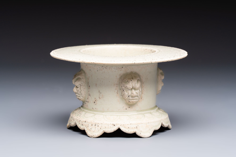 A Chinese qingbai censer with masks in relief, 20th C