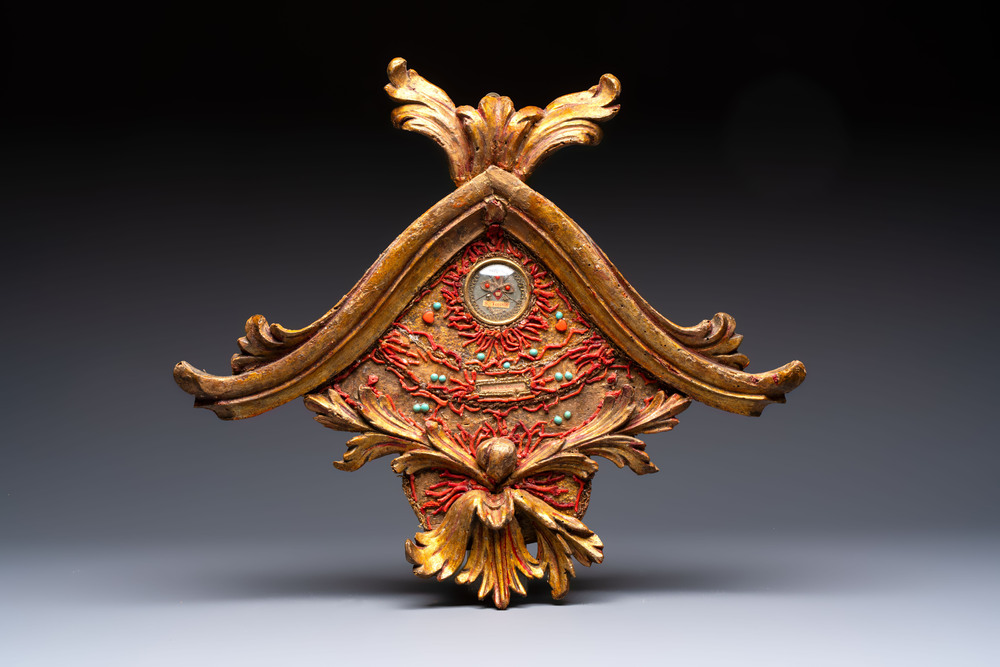An Italian carved wood and coral- and turquoise-decorated reliquary containing a relic ex cineribus of Saint Teresa of Jesus, early 20th C.
