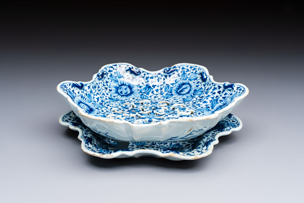 A fine blue and white Dutch Delft strawberry strainer and stand, 18th C.