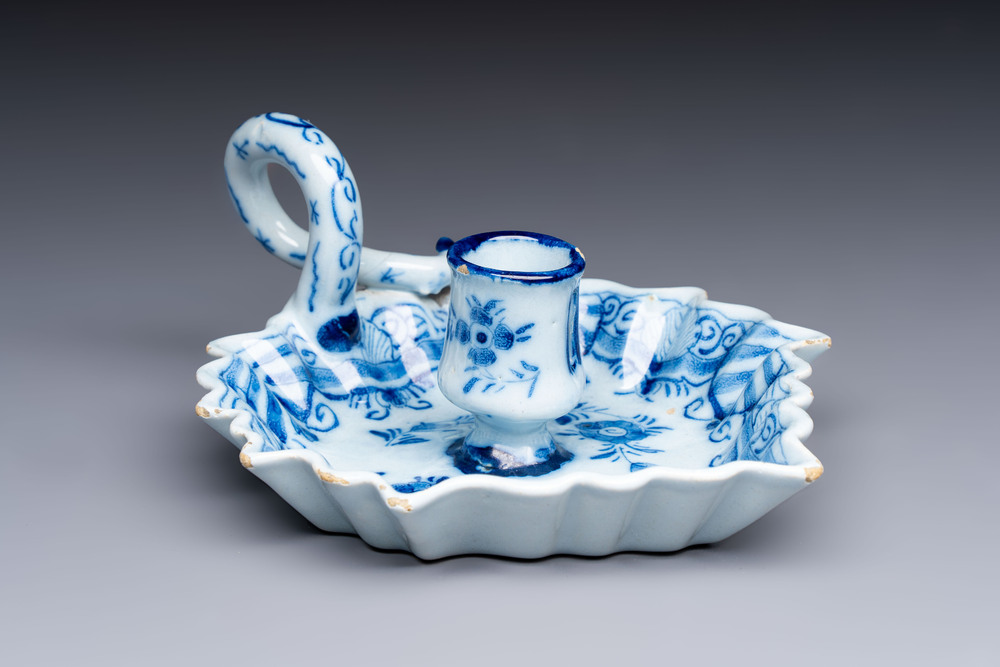 A blue and white Dutch Delft leaf-shaped chamberstick, 18th C.