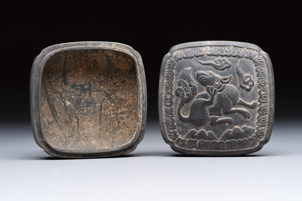 A Chinese carved black pottery 'Mythical Animal' box and cover, Yuan/Ming
