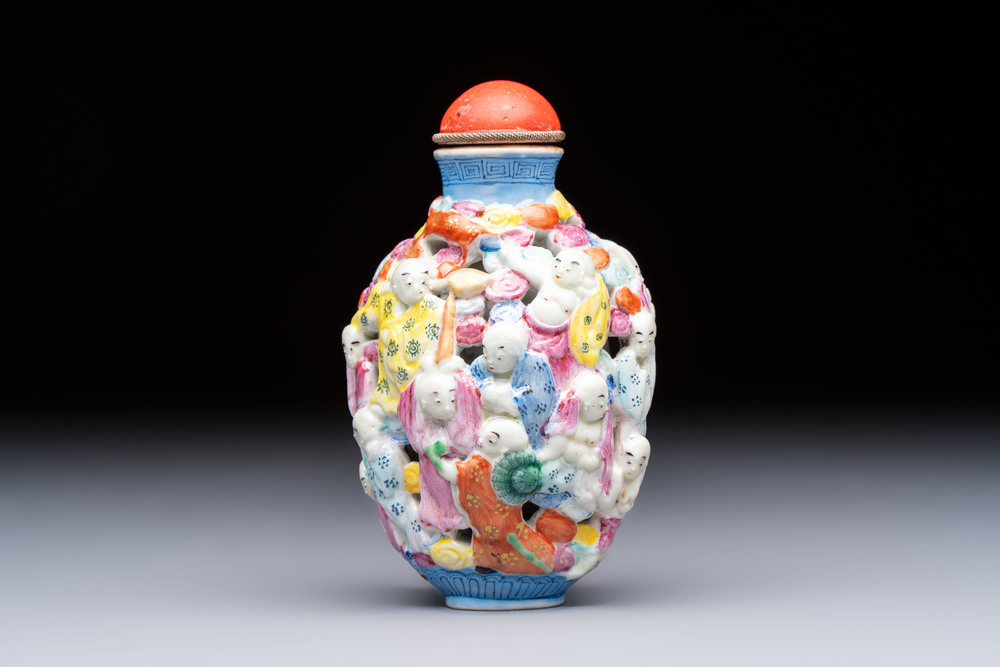 A Chinese famille rose moulded, reticulated and double-walled '18 Luohan' snuff bottle, Qianlong mark, 19th C.