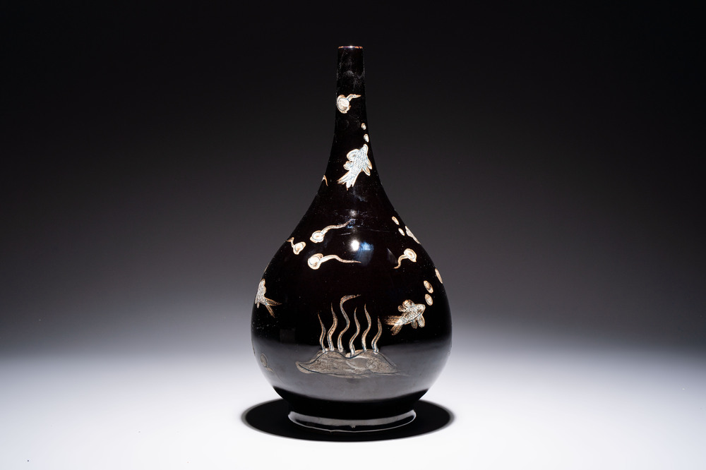 A Chinese black-glazed reverse-decorated bottle vase, 20th C.