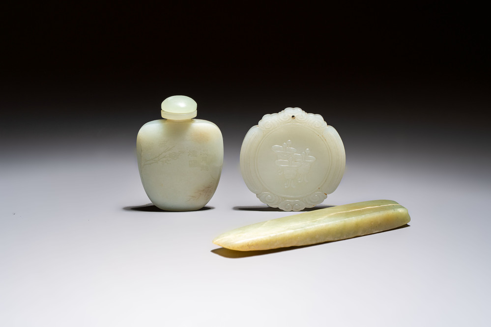 A Chinese celadon jade snuff bottle, a plaque and a ritual stick, Han and later