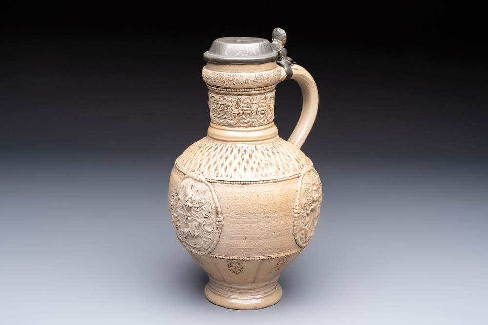 A Siegburg stoneware jug with mounted pewter lid, dated 1594
