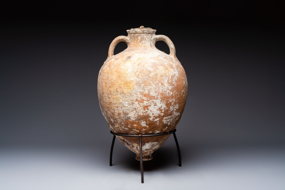 A Roman pottery olive oil transport amphora with original cover, South of Spain, 1st/3rd C.
