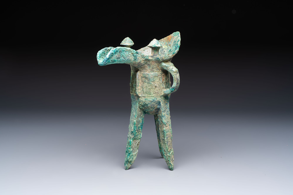 A Chinese archaic bronze wine vessel with Taotie design, Jue 爵, late Shang