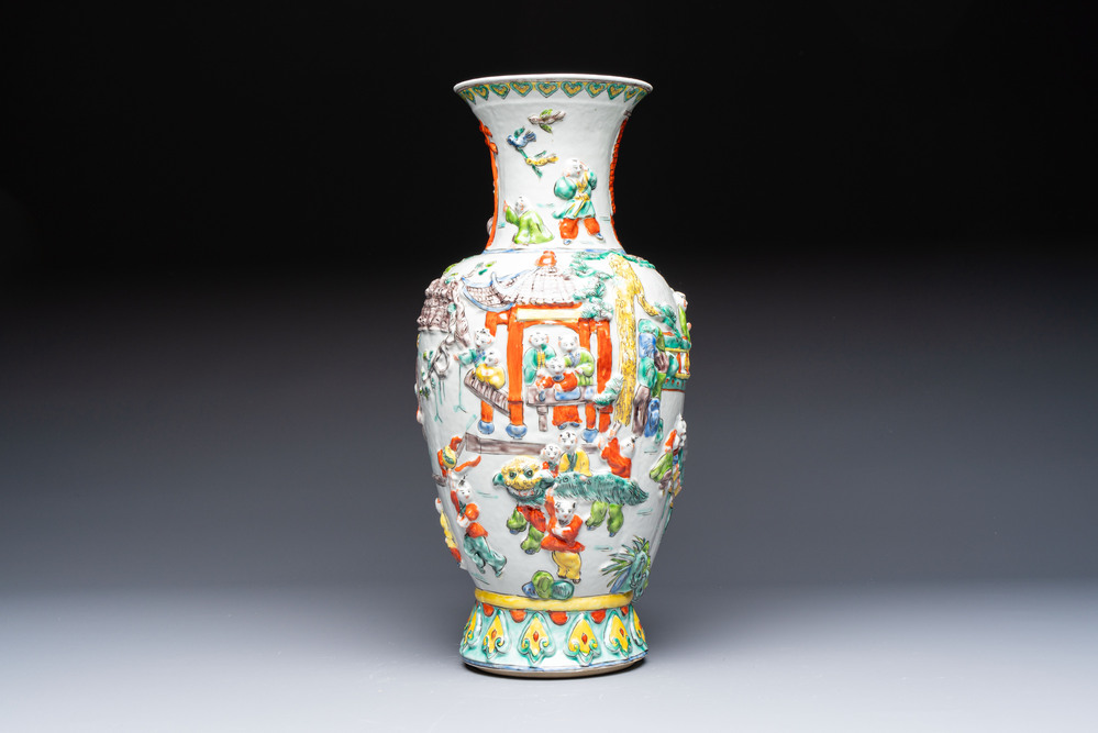 A Chinese famille verte '100 Boys' vase with relief design, 20th C.