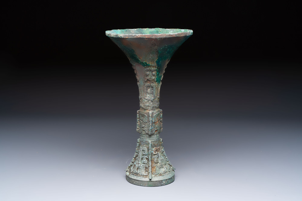 A Chinese archaic bronze wine vessel with Taotie design, Gu 觚, Shang