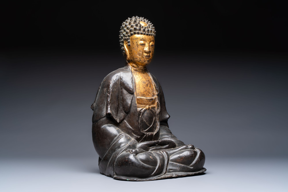 A large Chinese gilt-lacquered bronze Buddha, 17th C.