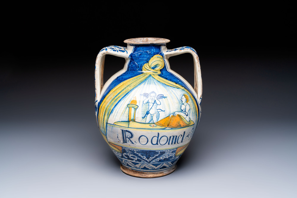 An unusual large polychrome Italian maiolica two-handled 'Cupid and Psyche' wet drug jar inscribed 'Rodomel', probably Rome, early 16th C.