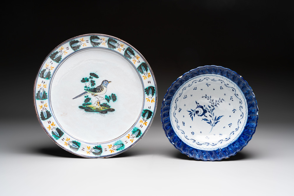 A large polychrome Brussels faience 'Bird' dish and a blue and white bowl, 18/19th C.