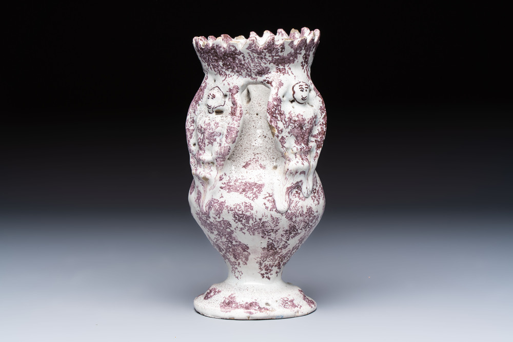 A continental manganese- and white-splashed pottery money bank, 18/19th C.
