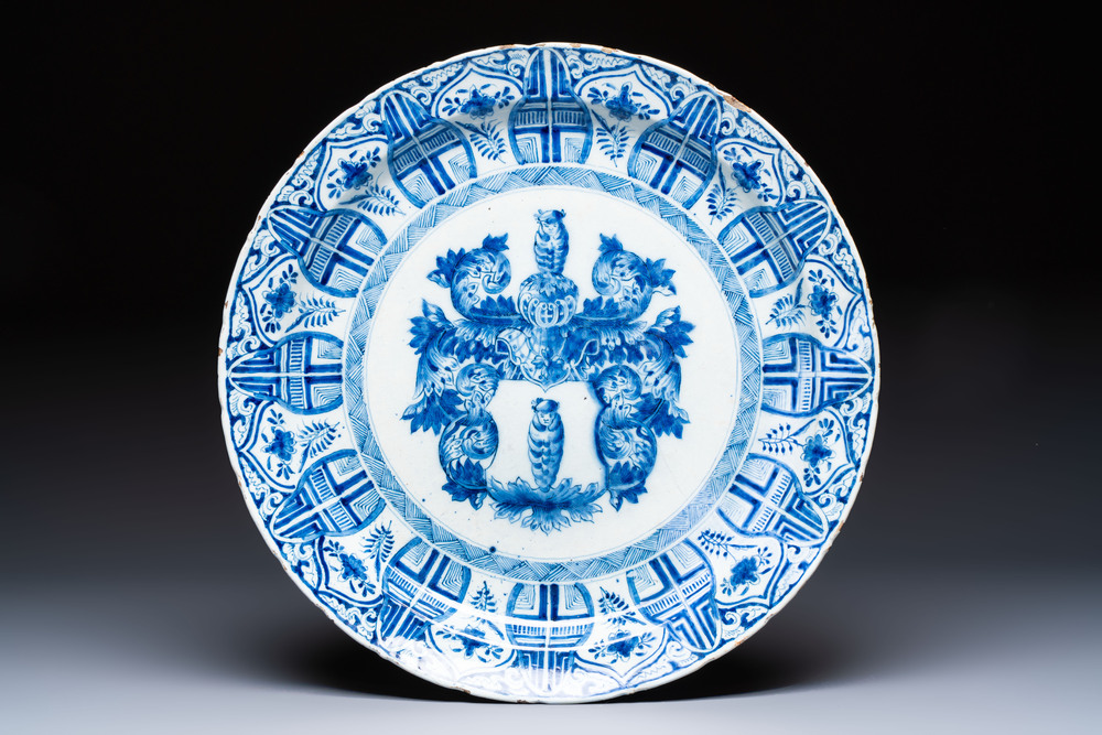 A large blue and white Dutch Delft armorial dish, 18th C.